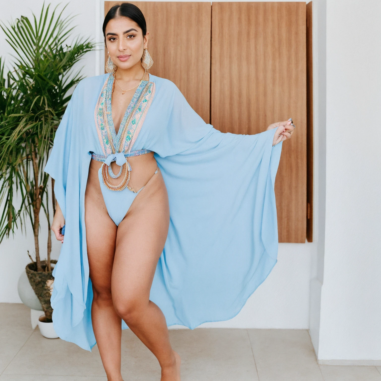 RAW photo,candid photograph, full body,photo of a beautiful,influencer,30yo Kurdish woman,wearing a pastel Kaftan, detailed skin,pubes,naked, looking at viewer, thick body structure,white background,no background, candid pose,blue light, film grain, kodak color, instagram LUT