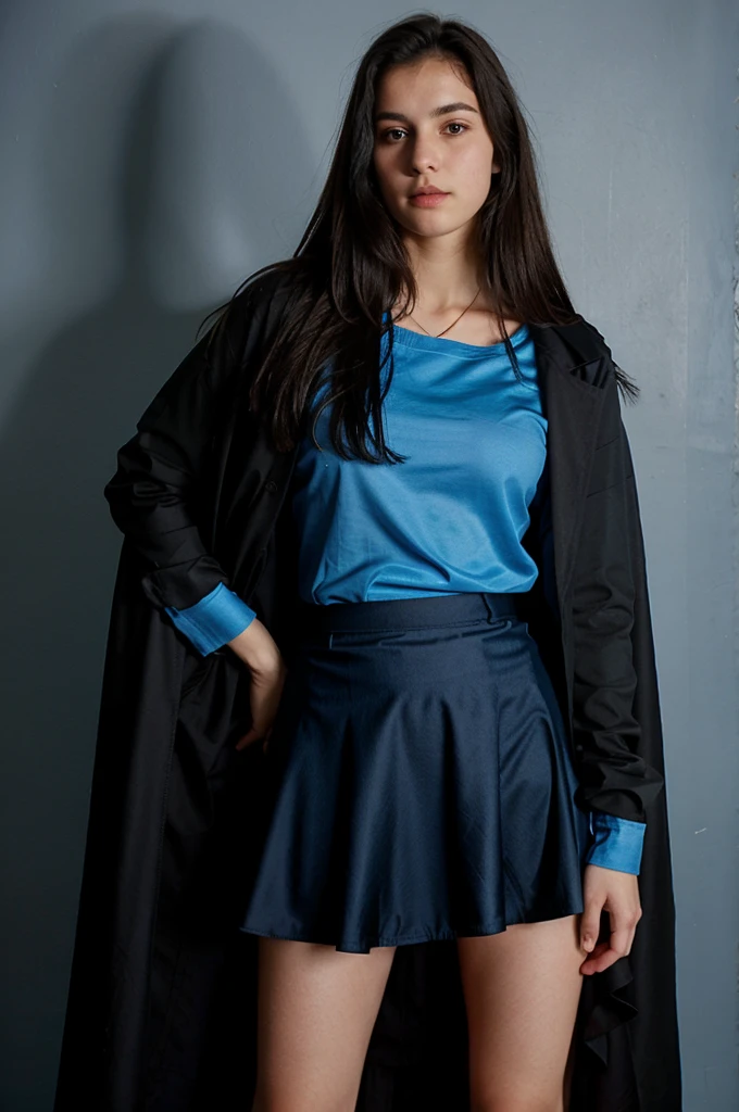 de 16 anos, with a long blue and black skirt, and a blue shirt, with a black jacket and a blue and black cape