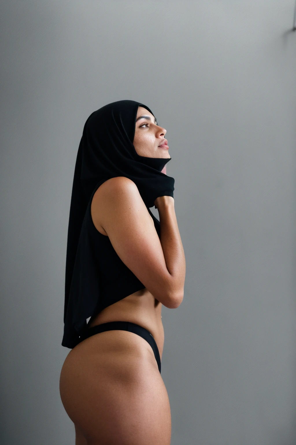 RAW photo,dark,moody,hazy atmosphere,35mm focal lenght,underexposed,cold,candid photograph,artistic,full body,photo of a beautiful,influencer,30yo Moroccan woman,black hijab,detailed skin,naked, looking away from viewer, thick body structure,grey background,no background, candid pose,dim room,blue light, film grain, kodak color, instagram LUT