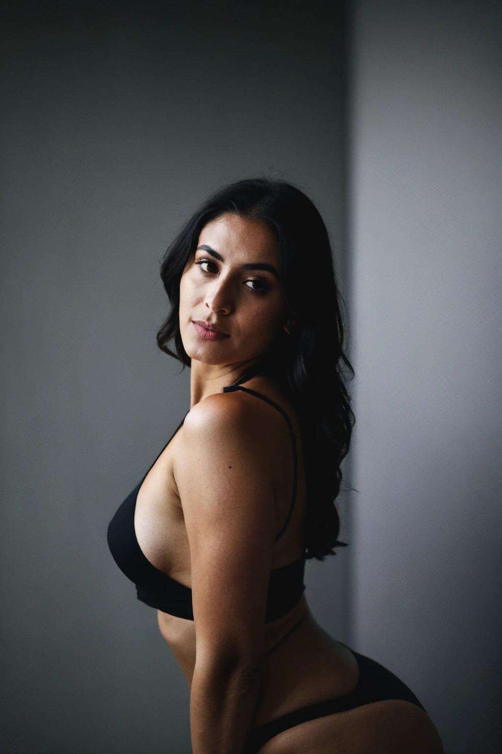 RAW photo,dark,moody,hazy atmosphere,35mm focal lenght,underexposed,cold,candid photograph,artistic,full body,photo of a beautiful,high-society,rich,elegant,30yo Kurdish woman,detailed skin, looking at viewer, thick body structure,grey background,no background, candid pose,dim room,blue light, film grain, kodak color, instagram LUT