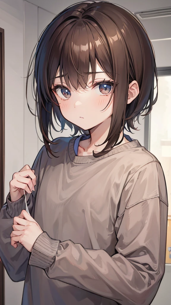 Boy with brown hair wearing gray sweatshirt