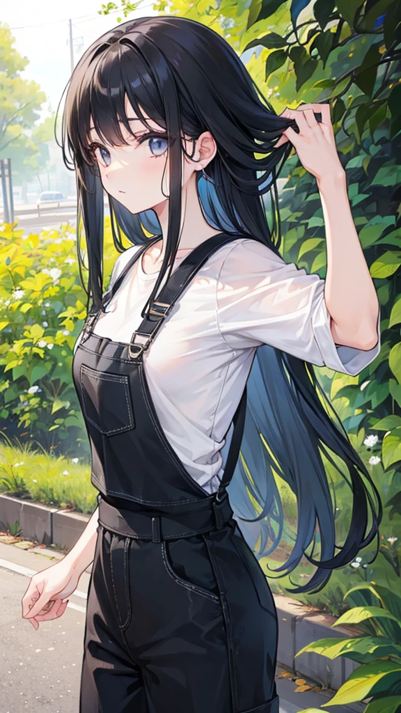 Girl with long black hair wearing overalls