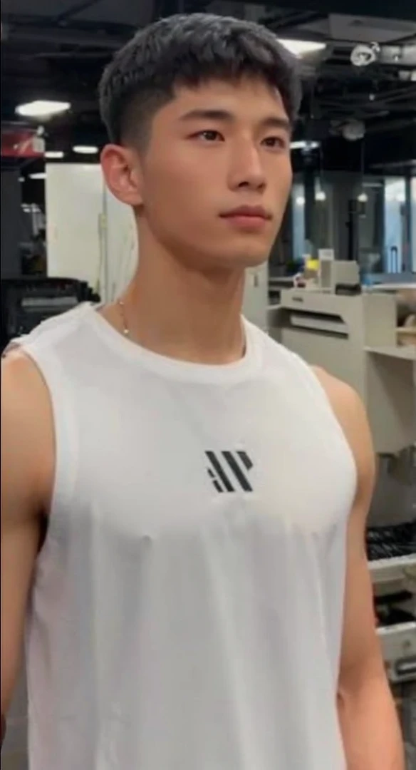 Handsome chinese young elite soldier wearing all black sleek soldier clothing. Looks like the man in the attached image.