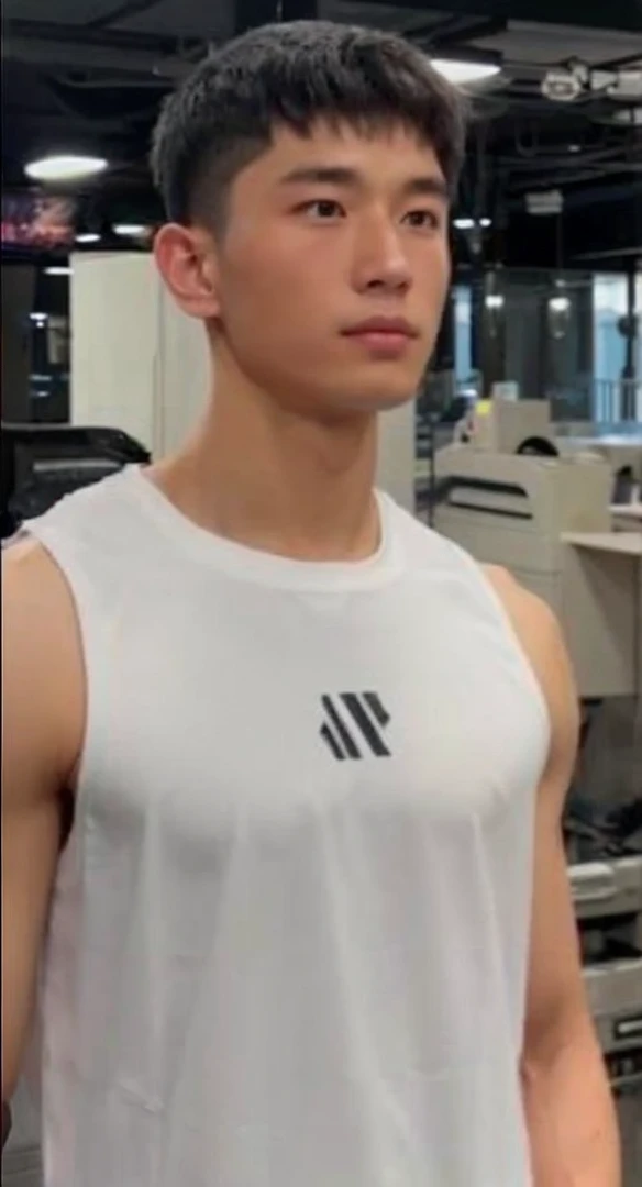 Handsome chinese young elite soldier wearing all black sleek soldier clothing. Looks like the man in the attached image.