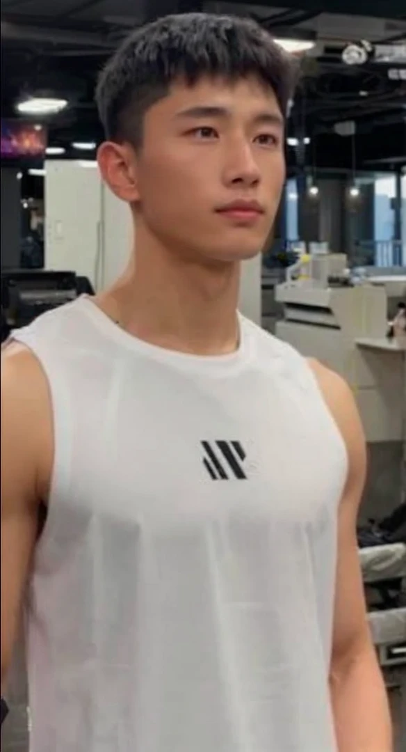 Handsome chinese young elite soldier wearing all black sleek soldier clothing. Looks like the man in the attached image.