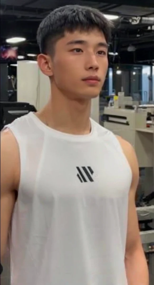 Handsome chinese young elite soldier wearing all black sleek soldier clothing. Looks like the man in the attached image.