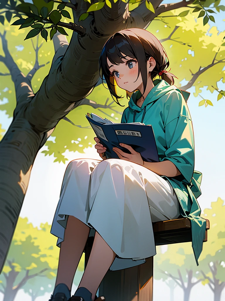 Girl sitting under a tree, reads the newspaper