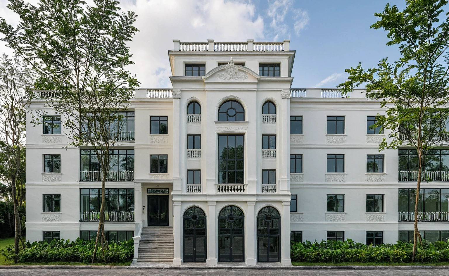 Raw photo, Masterpiece, high quality, best quality, realistic, super detailed, outdoor, neoclassical townhouse style, neoclassical traditional house, large glass windows and first floor, tiled roof green, pattern, white wall, sidewalk, grass, trees, tropical plants, clear sky, clouds, (natural light), (daylight:1.2)