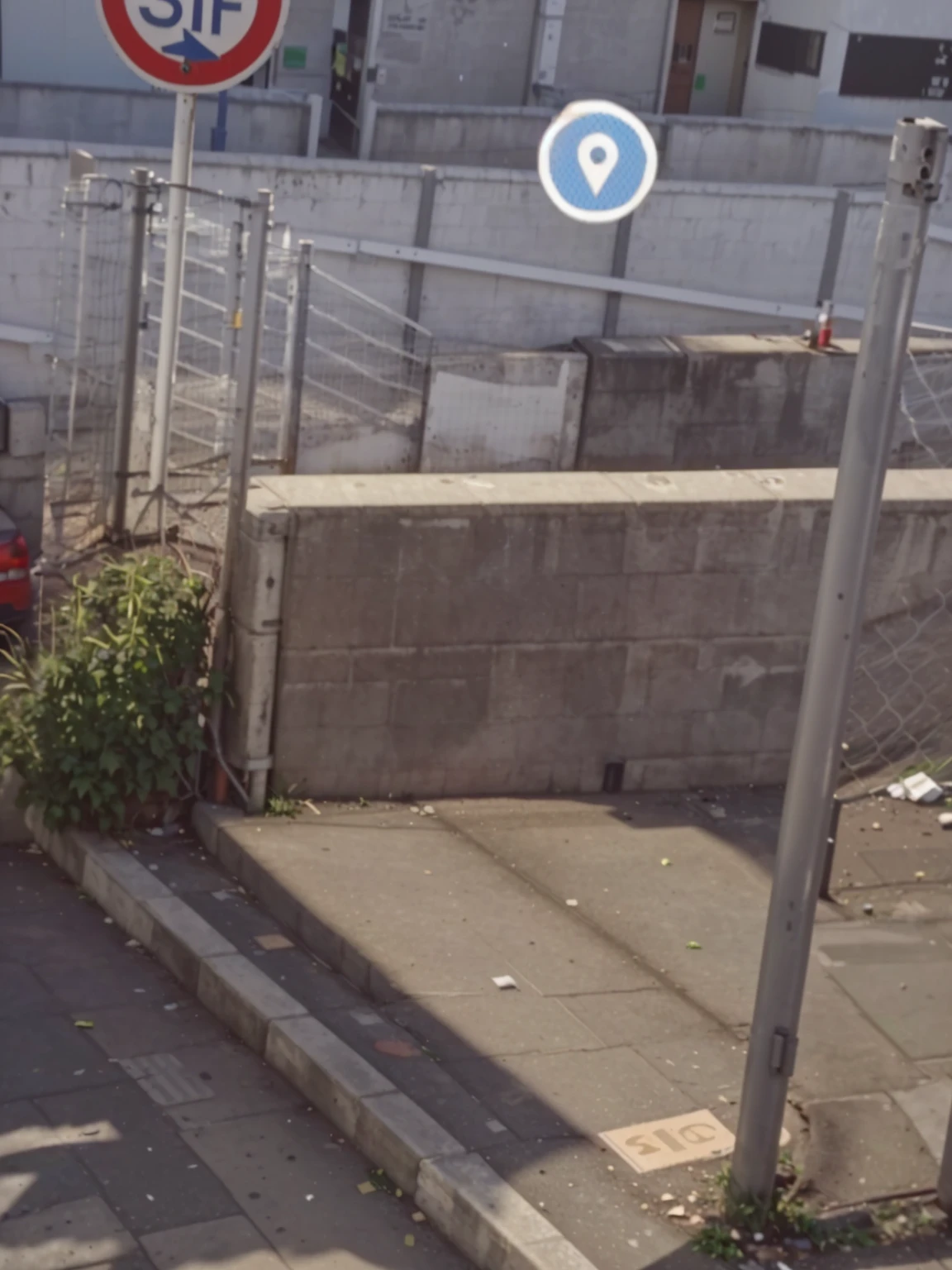There is a man standing on the sidewalk next to a fence., Found on Google Street View, very coherent image, Location ( Favela _ wall ), exploitable image, street view, very very low quality picture, strange camera angle, low quality footage, very very low quality, scanned photo, barriers, hidden area, Realistic Unreal Engine 3D game, discovered photo