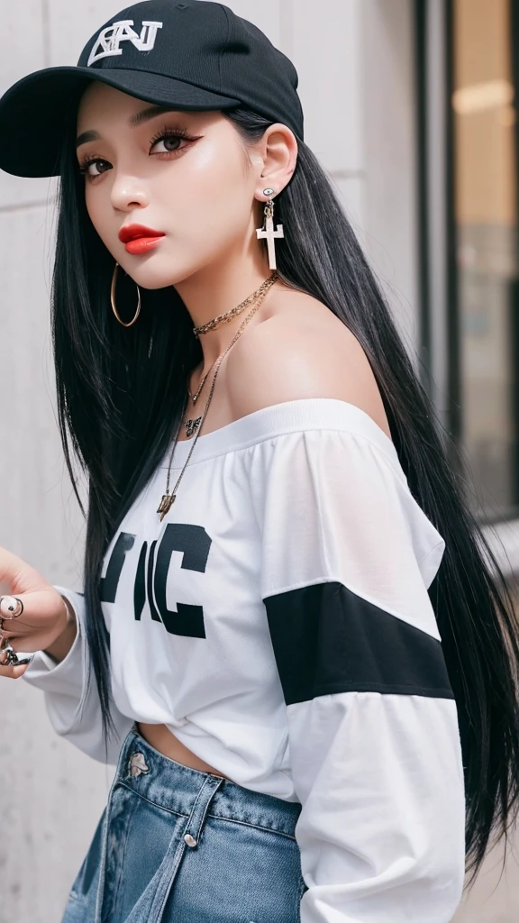 “A young woman with long black hair and gray eyes, wearing earrings. She has on an off-shoulder shirt and is styled like a rapper. She has tattoos on her arms and neck and wears a baseball cap backwards. She also has a cross necklace and is sticking out her tongue.”