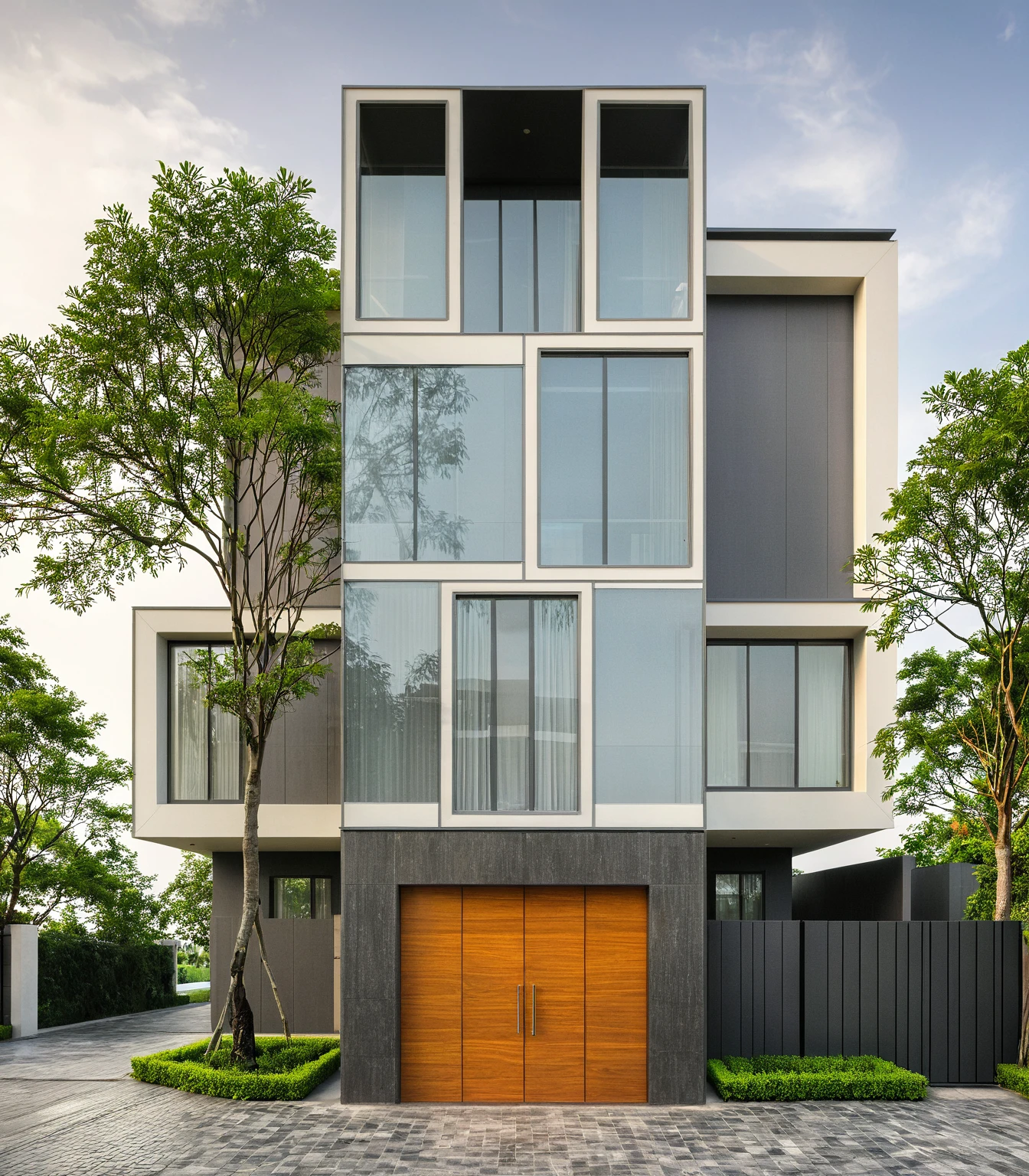 modern villa on street, (overcast lighting:1.2), tropical tree, vivid color, streetcapes, nice sky, grey and wwhite tone, (large glass door:1.2), warm interior lighting, modern material, best quality, ultra realistic, masterpiece, 17ArchiAI_XL_VL-v1