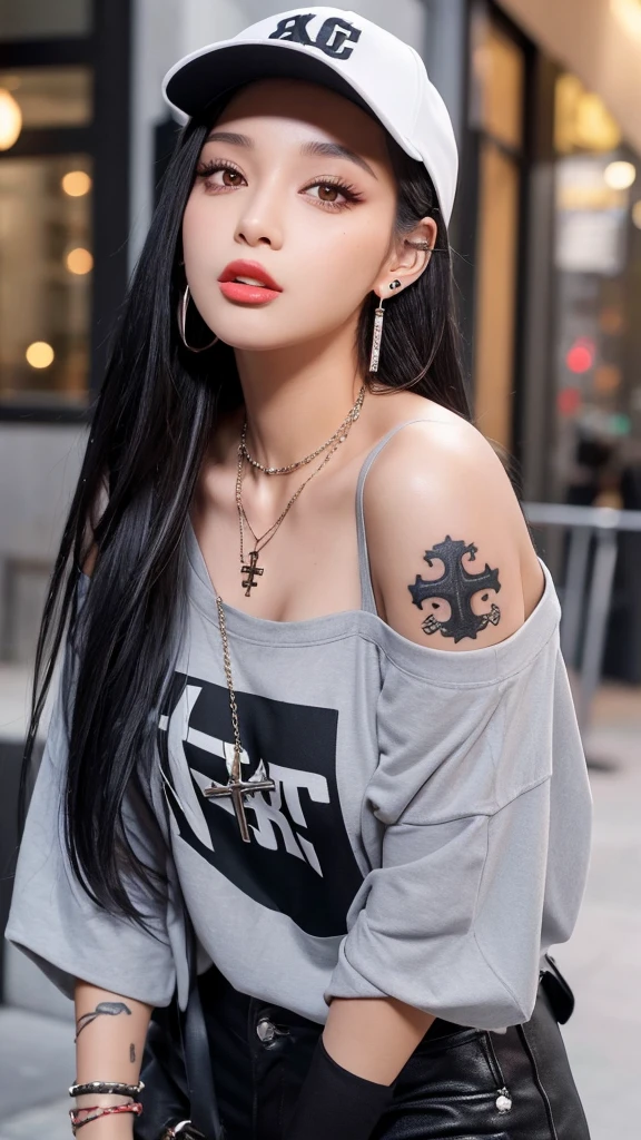 “A young woman with long black hair and gray eyes, wearing earrings. She has on an off-shoulder shirt and is styled like a rapper. She has tattoos on her arms and neck and wears a baseball cap backwards. She also has a cross necklace and is sticking out her tongue.”