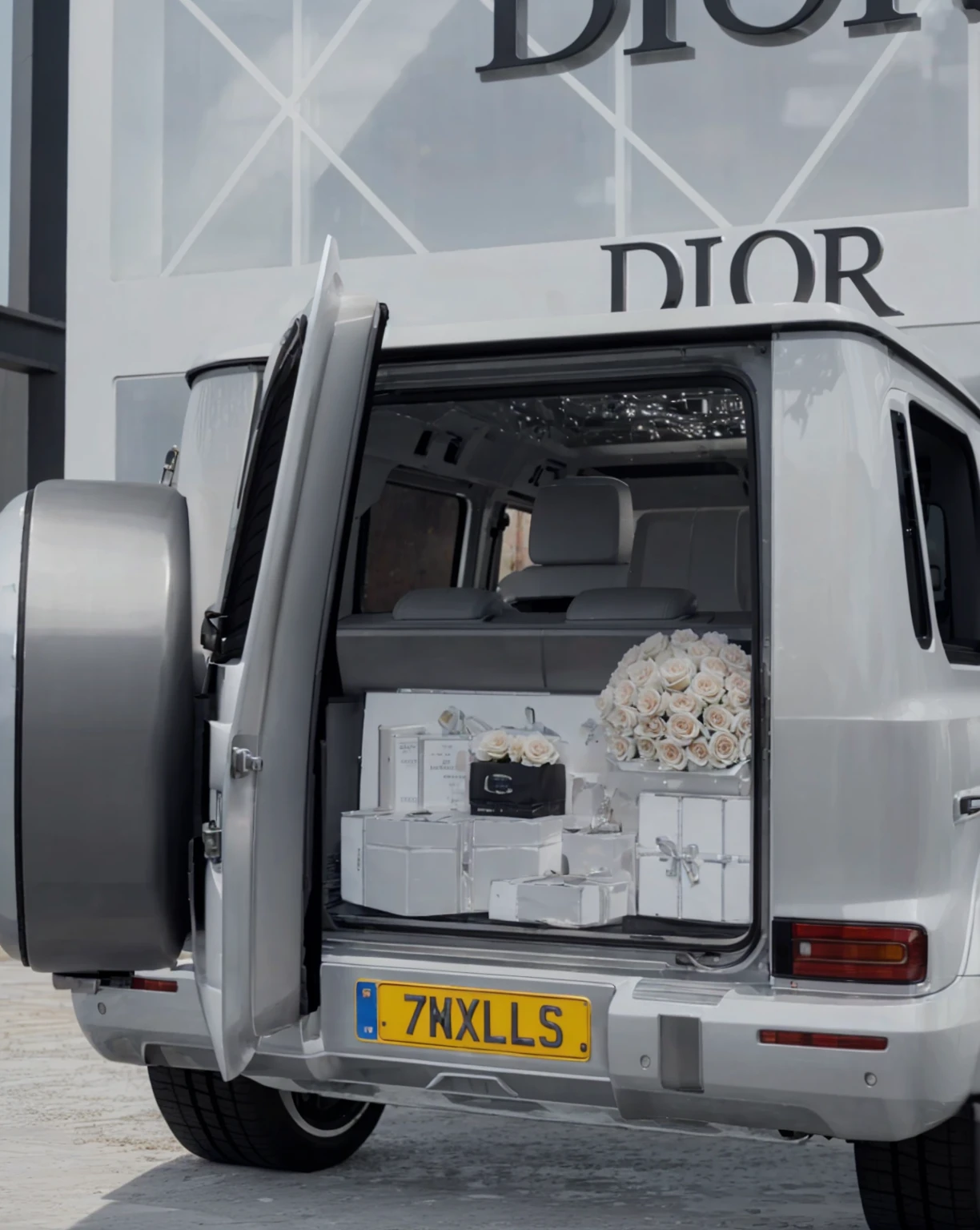 Realistic roses , white roses, chrome silver car , realistic number plate, real tyres, real concrete , real glass walls , real glass texture , hd , ultra quality , 8k , sharpen , hd 