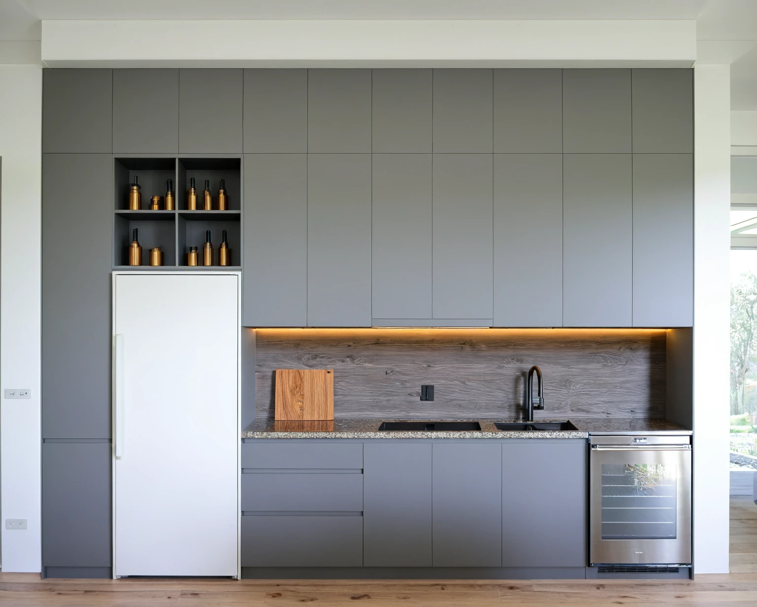 Raw photo,Masterpiece, high quality, best quality, authentic, super detail, interior, KITCHEN CABINETS style modern, sunset, day light, HIGH CEILING KITCHEN CABINETS, REFRIGERATOR, INDUCTION KITCHEN, EXHAUST, GRAY AND WOODEN TONES, WOODEN, GRAY