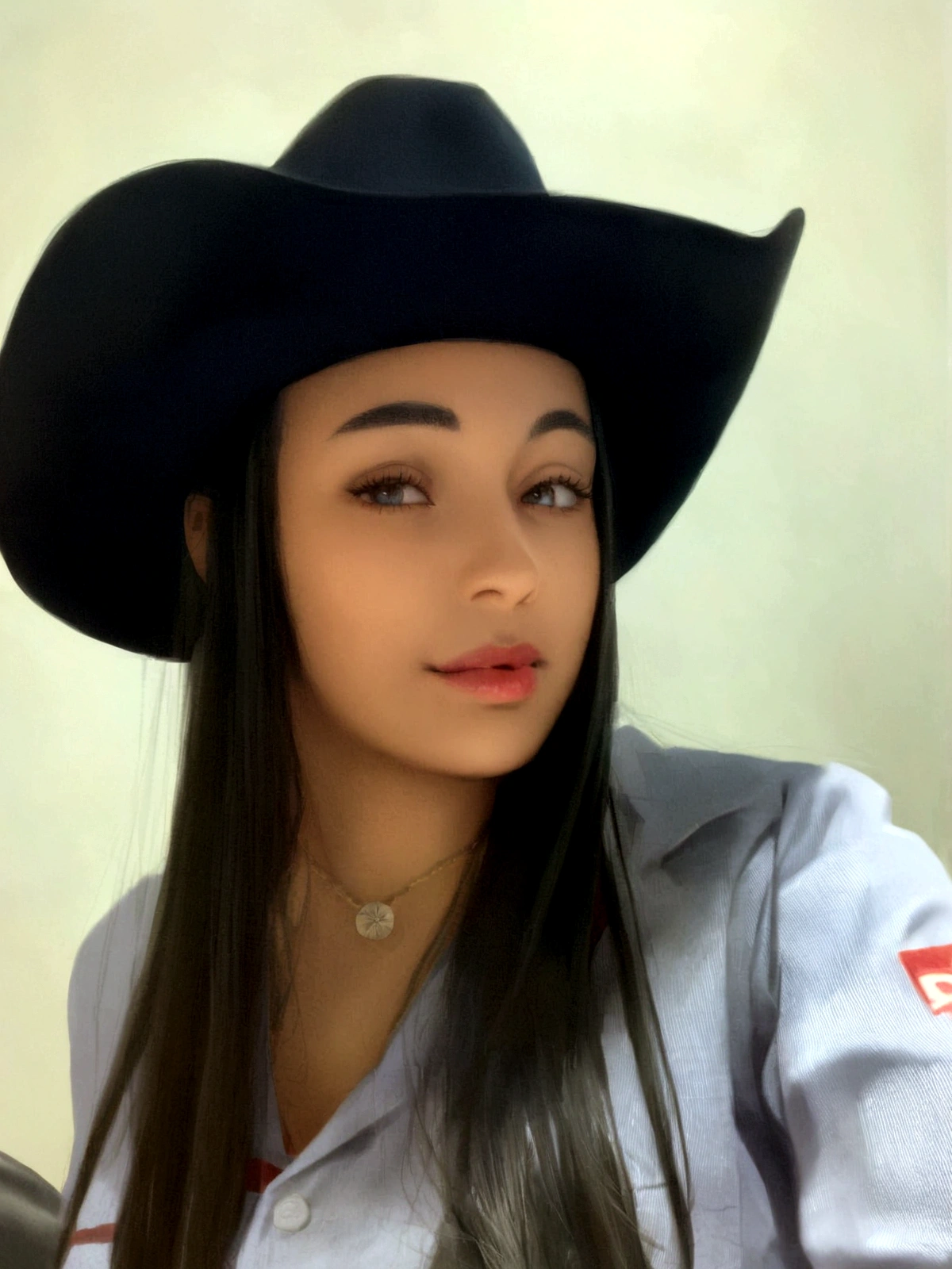 woman with cowboy hat in a park at night