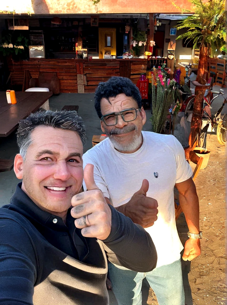 there are two men standing outside giving a thumbs up, brazilian ronaldo, instagrampost, Marte Ravelo e Greg Rutkowski, reddit post, edu souza, post, giving a thumbs up to the camera, to be returned, inspired by Francisco Souza, with wart, eloymorales, david rios ferreira, by Pogus Caesar, filmed on iphone 1 3 pro max