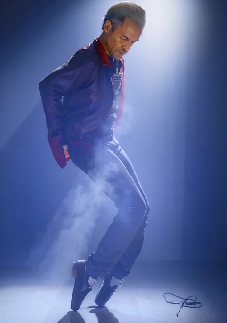 A Old Black man with receding hair line looking to the Floor and wearing a red leather jacket and wearing a Black pants and Dancing 