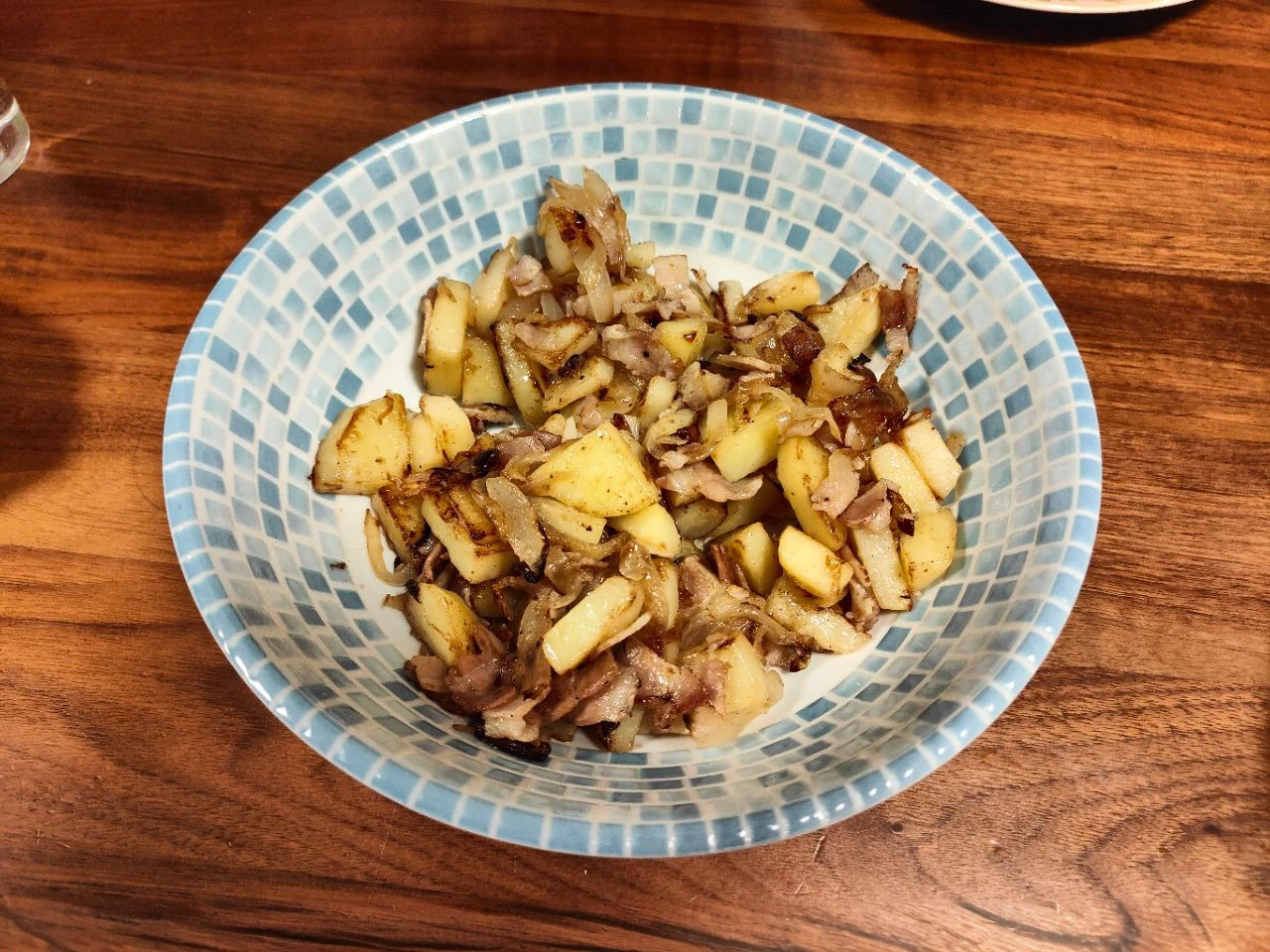 There are many plates and dishes with Japanese food around the area.