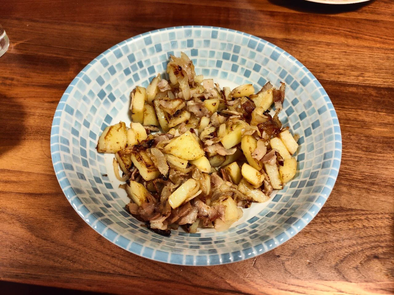 There are many plates and dishes with Japanese food around the area.