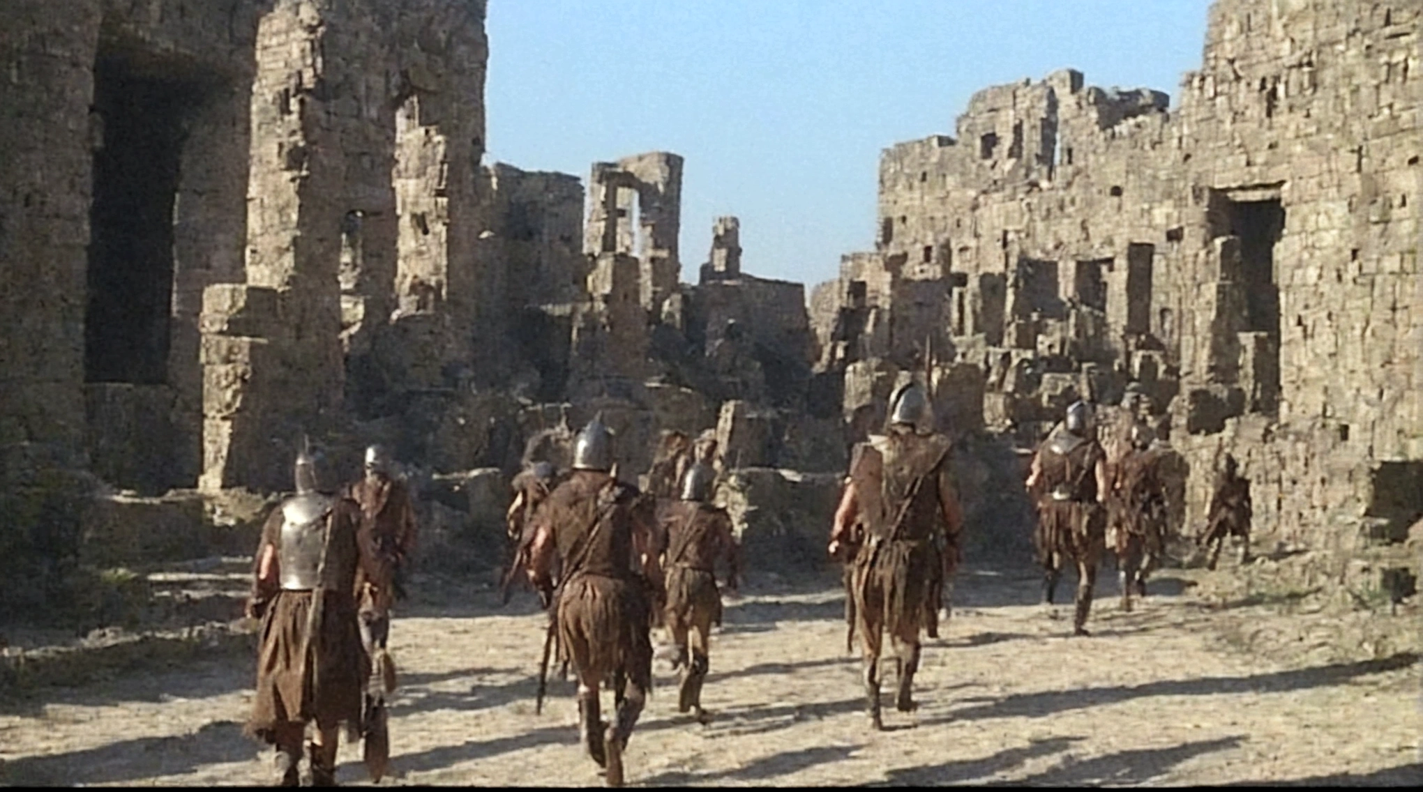 Create an image professional 3d rendering:1.3) de (Realistic:1.3) Foto de arte mais bonita do mundo depicting Julius Caesar and his army passing through a desolate Alpine village. Highlight the contrast between the mighty Roman general and the humble surroundings. hyperrealist image