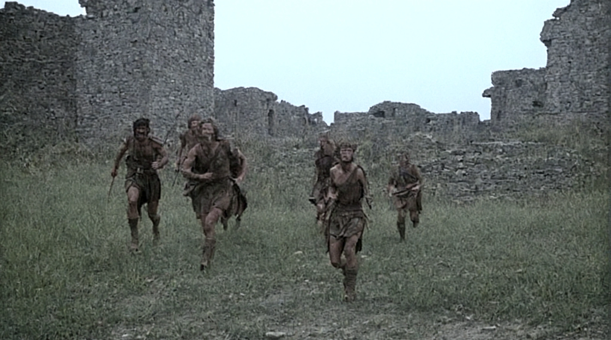 black and white, grainy old footage, 35mm vintage, frightened 18th century explorers running from two giant-spartan soldiers among ancient ruins