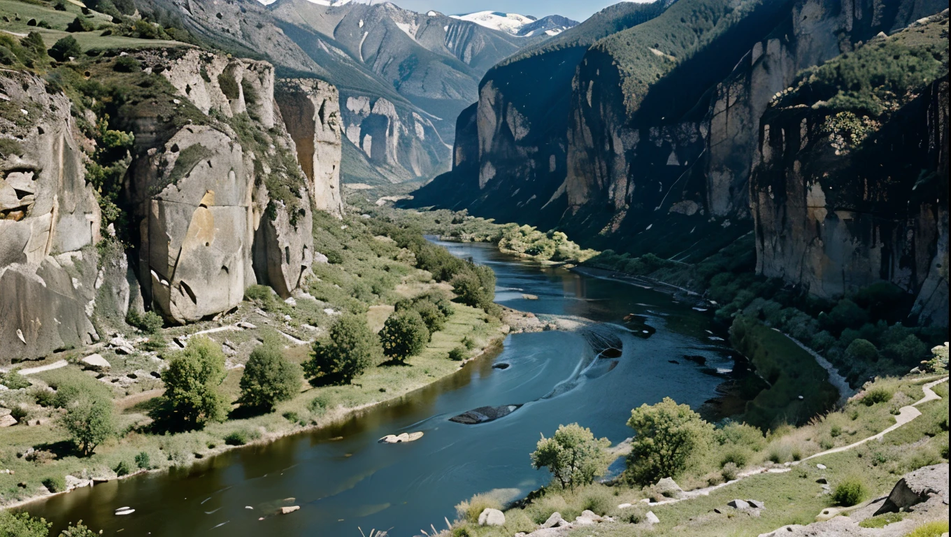 Prehistory. Before the appearance of man. Deep valley surrounded by impressive rock walls. A river runs through the valley. Green meadows and snowy mountains