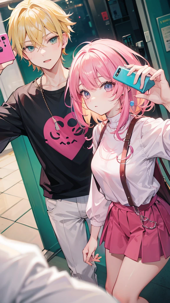 Young man with blond hair combed, taking a selfie with a girl with pink hair