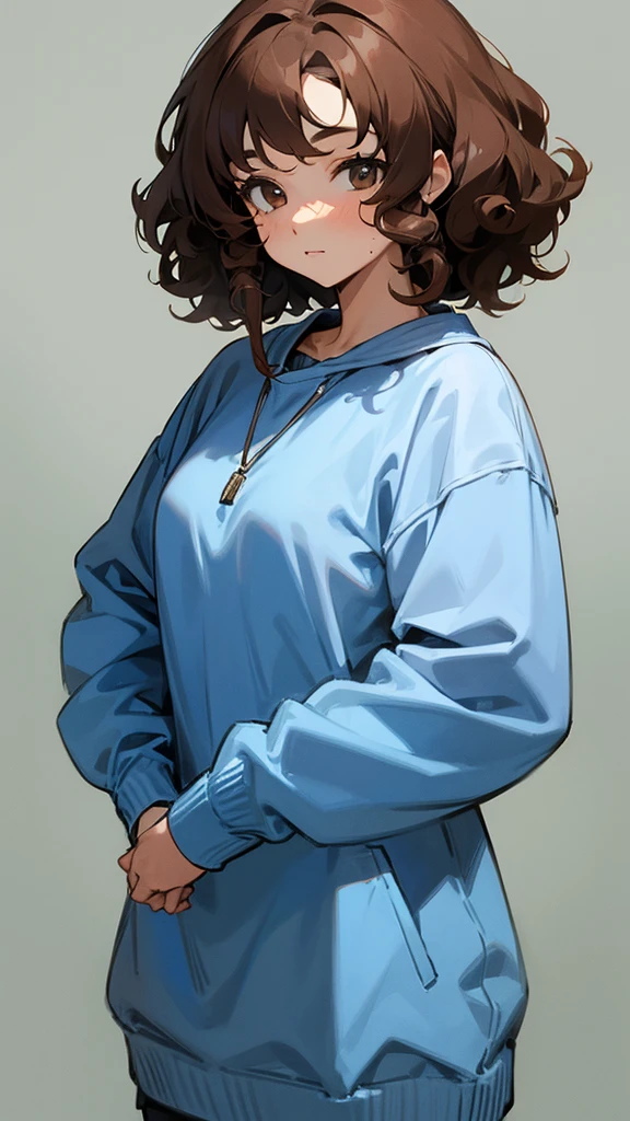 Girl with brown curly hair wearing a blue sweatshirt