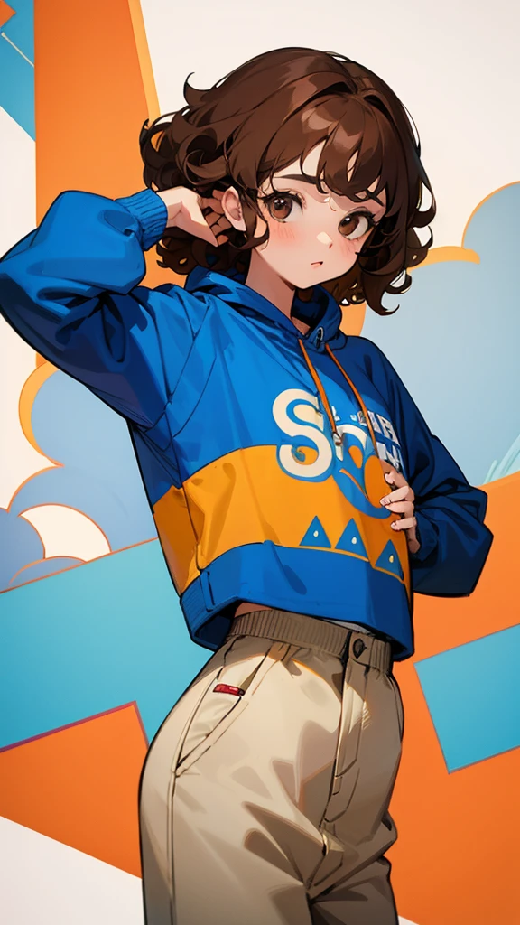 Girl with brown curly hair wearing a blue sweatshirt