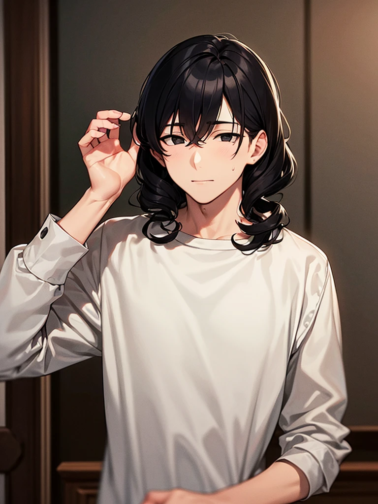 An adult man with curly black hair and black eyes, wearing a long white long-sleeved shirt