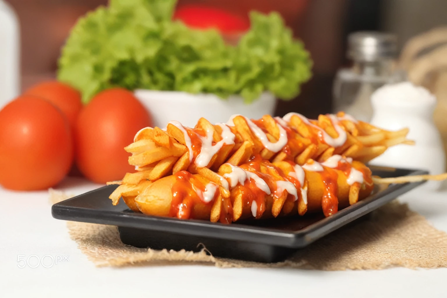 There is a plate of food with a lot of sauce on it, Serve French fries, professional food photo, appetizing, professional Food photosy, amazing Food photosy, high quality Food photosy, Hyper-realistic food pictures, hot dog, 烤肉string, string, Food 4k, Crisp and sharp, Food photosy, French fries as arms, Food photos, French fries