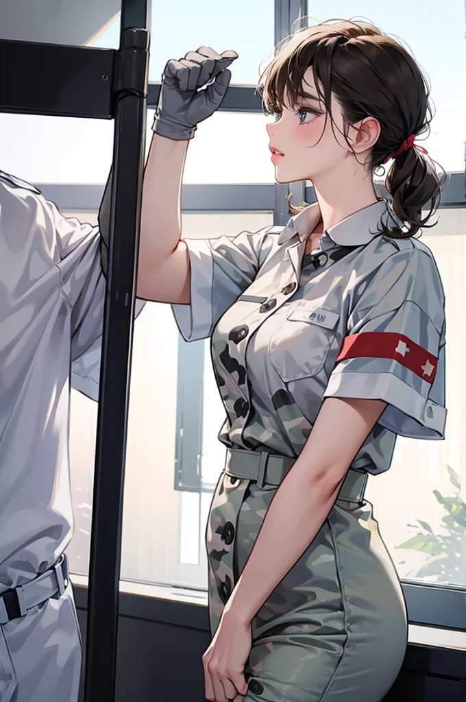 Female nurse kisses camouflage uniformed male soldier\