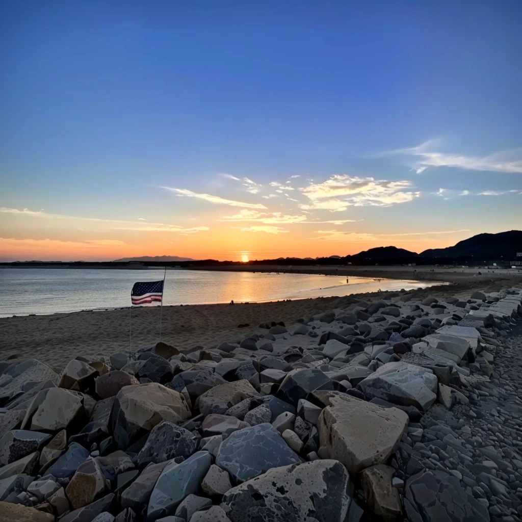 Overlooking the beach,There are rocks and a flag on it, Sunset, Shot with iPhone 1 3 Pro max, Shot with Sigma 2.0mm f/1.0. 4, Sunset, Shot with Canon EOS R 6, Shot with iPhone 1 3 Pro, Shooting during the golden hour, 8k hdr sunset lights, Shot with iPhone 1 3 Pro