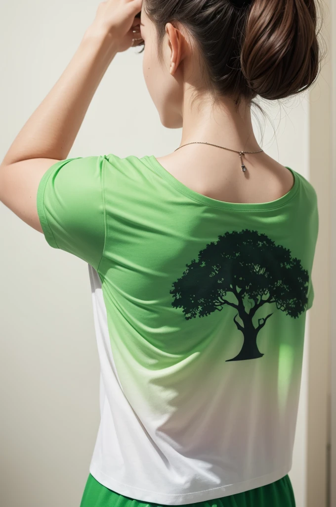 A t-shirt with a green gradient tree design on the back

