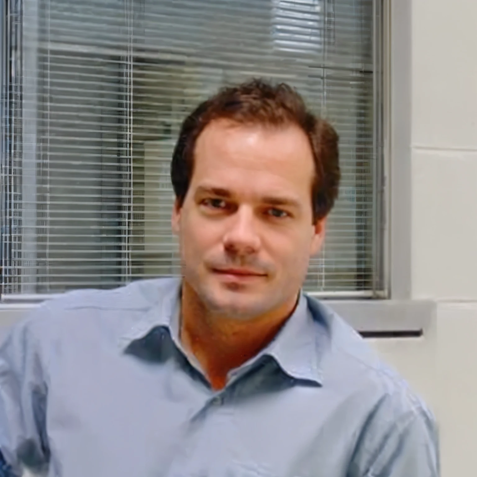 caucasian man wearing a blue shirt