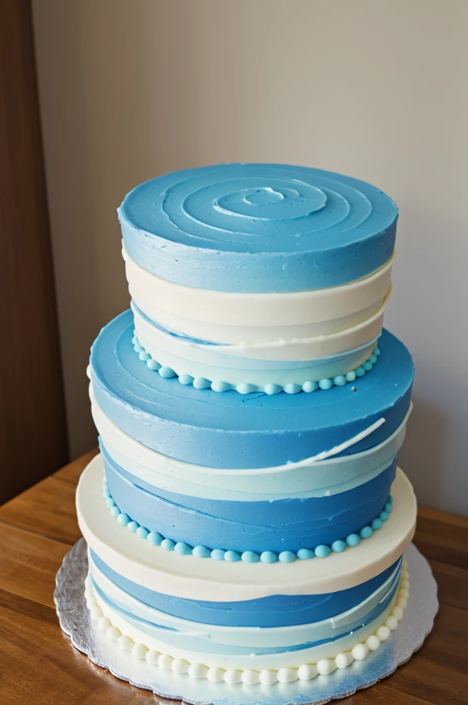 Cake 4 tiers, each one lighter blue than the other