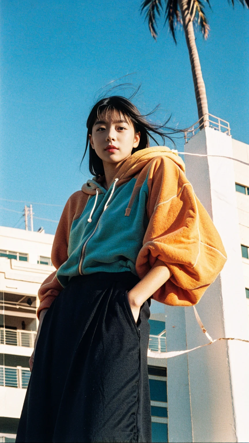 Best Quality,Masterpiece,Ultra High Resolution,(Realisticity:1.4),Original Photo, 1Girl,1 girl, wear ((orange color oversized hoodie)), (purple tennis skirt), light leak,dark intens shadow,ultra high resolution,UHD,beautiful, black bob hair, almond eye, no makeup, in front of 80's architecture colorful motel, (from below:1.2), (realistic:1.2), (surreal:1.3), (very detailed:1.1), ((masterpiece)),summer, blue sky, (palm trees),sunny, los angles vibes,thick outline. blurry photo. color slide film. 1958