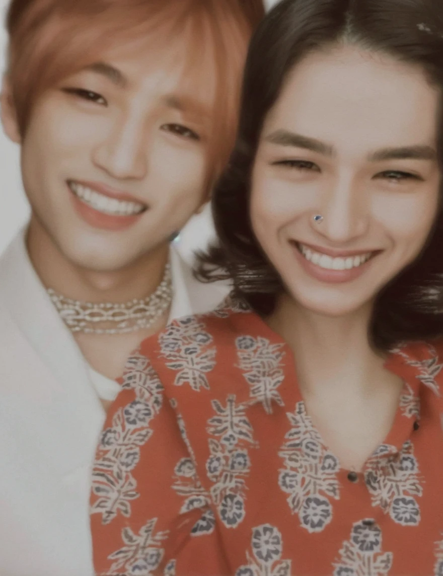 high high quality,A man wearing a necklace and coat stands in front of a white background, kim Taehyung , wearing a turtleneck and jacket, he is wearing a brown sweater, he has short curly brown hair, inspired by jeonseok lee, he has an elongated head shape, xqc, with same hairstyle, Solid Backgroud