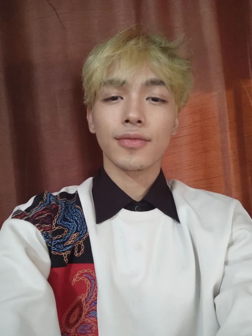 A korean young men with blond hair