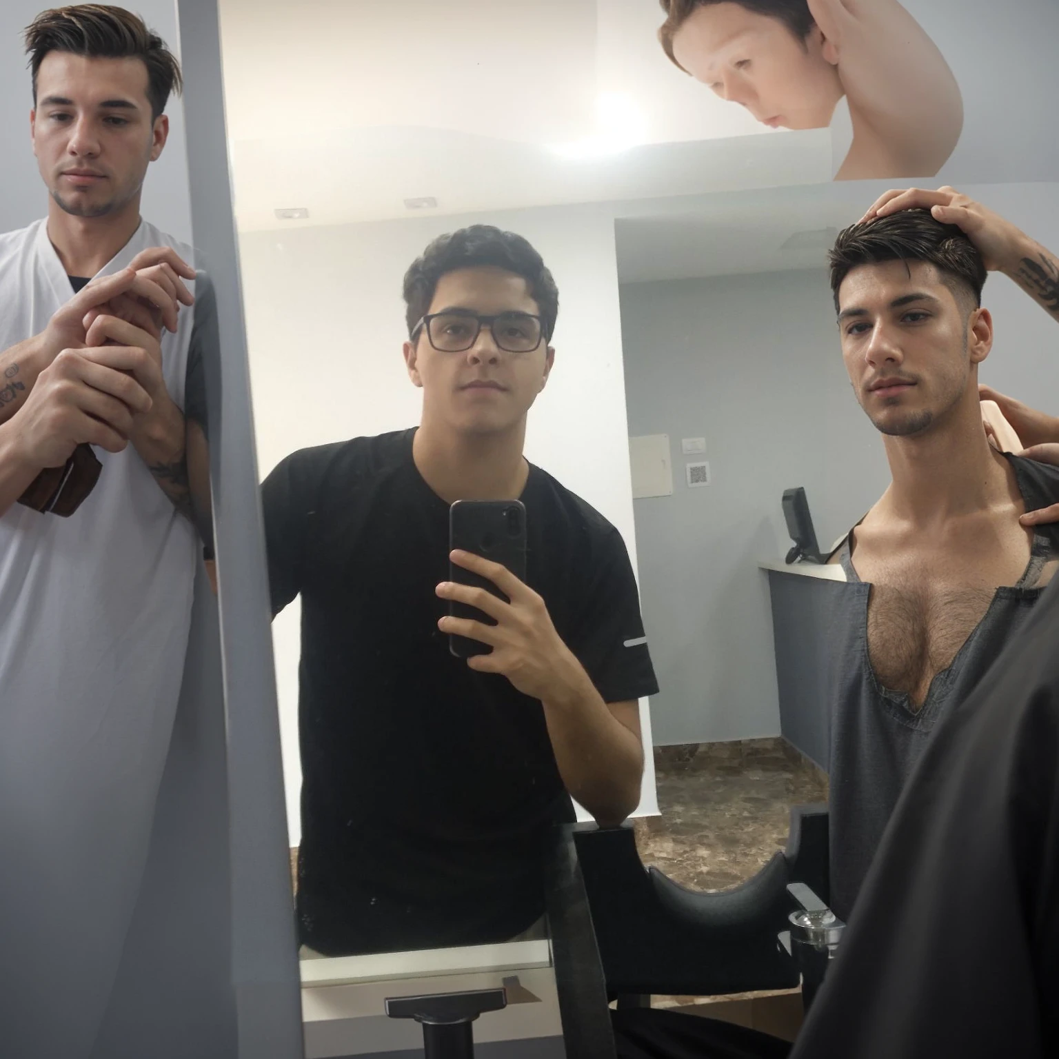 Inside a barbershop, with people getting their hair cut, a barber's mirror clear lighting