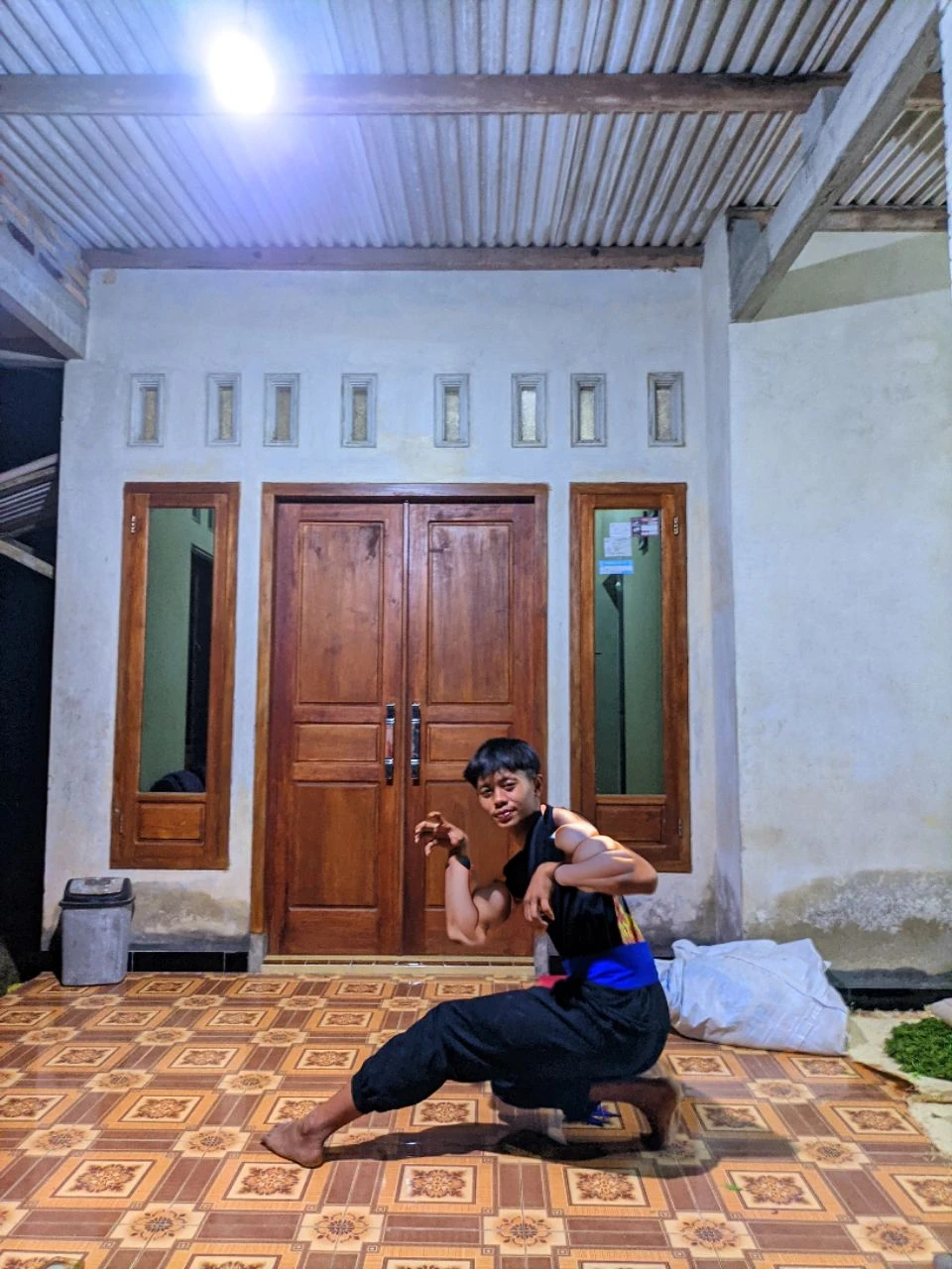 (Masterpiece, Best quality, 18 year old boy, 8k, ultra-detailed), (underneath, looking away, upper body, warm eyes, thin lips), 1 boy, solo, Young, (ager), (Dark Short straight hair, under cut), black eyes, full bodyesbian, (Shirtless), topless, Green headband, sandals, (Black shorts with loincloth), (Depth of field:1.2), (Abs), (chest), (upper arms), black wristband, (topless male), man with martial arts stance, athretic body, kneeling pose, inside caves, (foggy night)