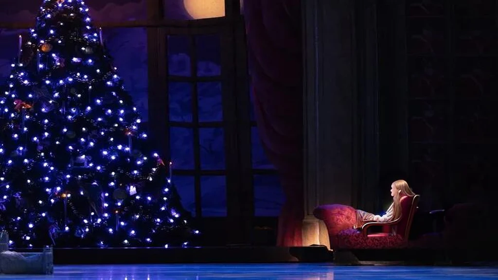 a chair in front of a christmas tree, media photo, foreground background, footage of a theater stage, press photos, holiday season, ( ( emma lindstrom ) ), musical, full image, background image, beautifully, trending photo, !!beautiful!!, cutest, photo still