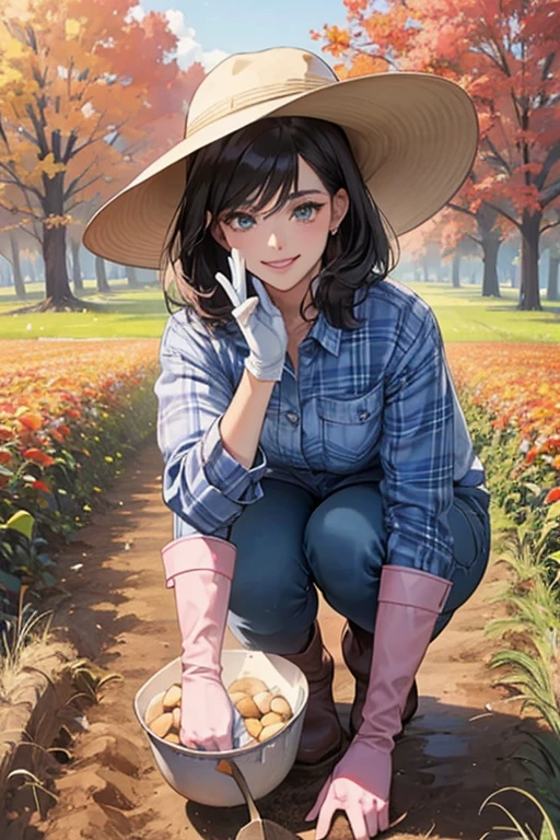 A dark-haired mature woman wearing large pink rubber gloves, white rubber boots, a hat, jeans and a blue flannel shirt digging potatoes in an autumn field while smiling gently