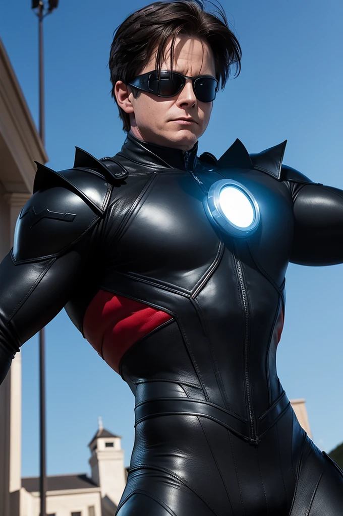 O ator Michael J. Fox playing Marvel superhero Cyclops in front of the Xavier mansion in an image set in the 80s. He wears a black leather suit with a dark x on his chest and a black visor with a red line through his eyes.
