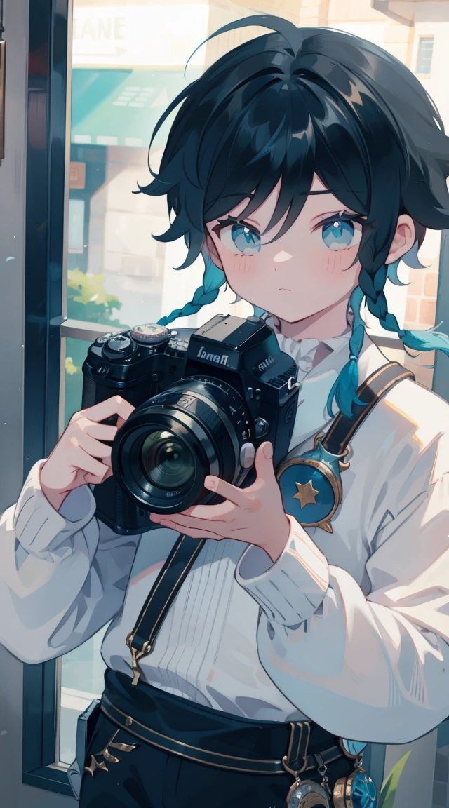 Handsome boy holding a camera taking pictures