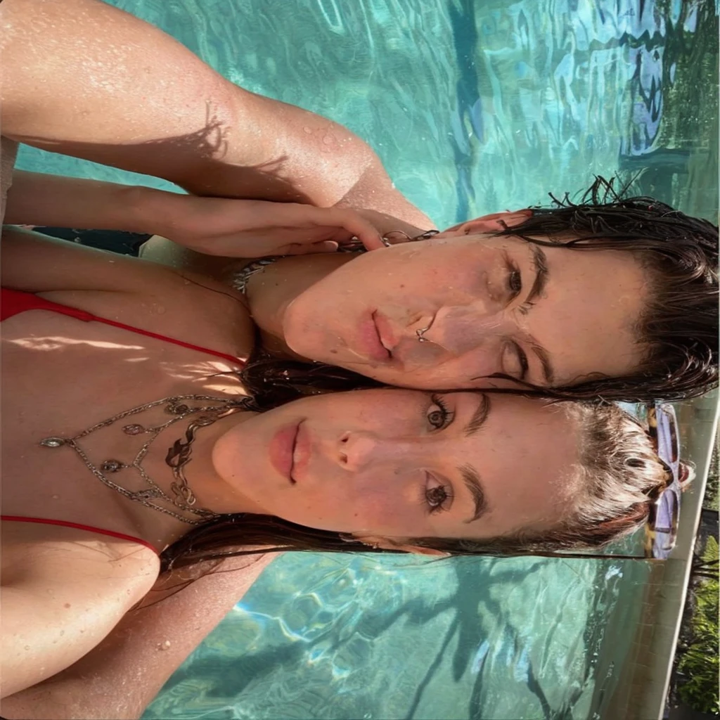 they are in the pool, charli bowater and artgeem, profile pic, profile image, leaked, they are siblings, next to a pool, in a swimming pool, profile shot, charli bowater, in water up to her shoulders, in style of petra collins, taken in the early 2020s, older sister vibes, valentina remenar