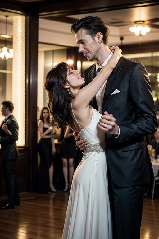 Tall man dancing with woman at party
