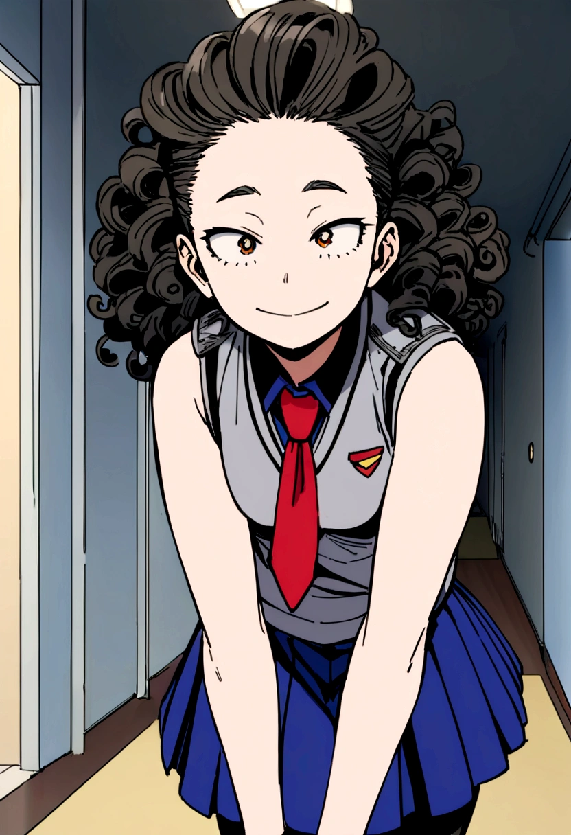 Screenshot of boku no hero academia.
Beautiful 16 year old girl, with curly hair, long and black. He is wearing the UA uniform, a gray vest, Red tie, blue skirt and black stockings. In the background is a hallway of the UA. The chicha stares at the camera and has a happy expression.