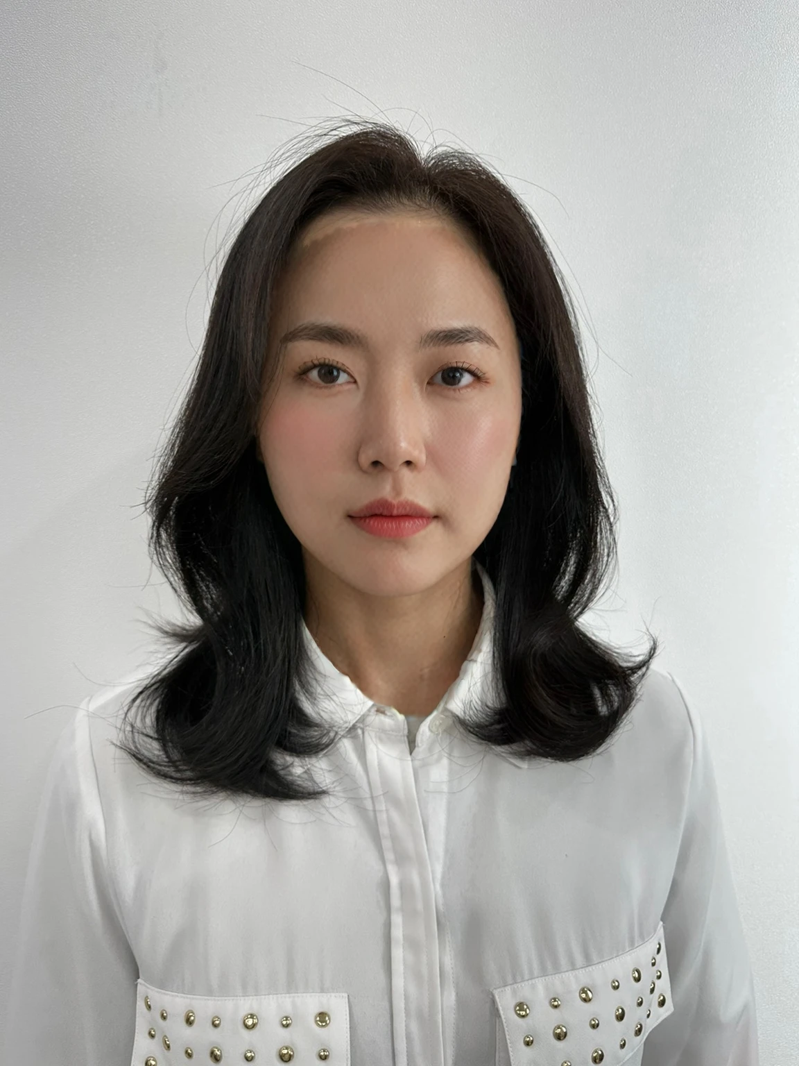 Best Quality, 8k, Masterpiece, (Portrait: 1.3), (photo realistic:1.4), (hyper realistic:1.4), Sharp Focus, looking at viewer, (smoother lighting:1.1), (increase cinematic lighting quality:0.9), realistic lighting, backlighting, light on face, ray trace, (brightening light:1.2), (Increase quality:1.4), sharp detail, (best quality real texture skin:1.4), finely detailed eyes, black_eyes, finely detailed face, 25 year old Korean woman, (white formal_shirt:1.4), (Create an image maintaining the original base model hairstyle:1.5)