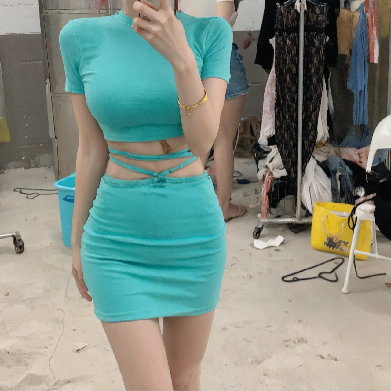1girl, s41oc, wearing a crop top shirt and denim shorts standing in corn field on a farm, cowboy hat, red hair
